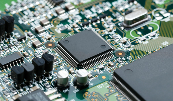 How is parasitic capacitance formed in MOS transistors